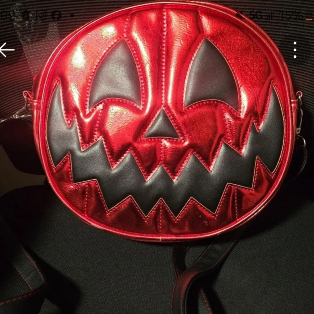 Love, Pain, and Stitches Red and Black Pumpkin Face Crossbody Bag